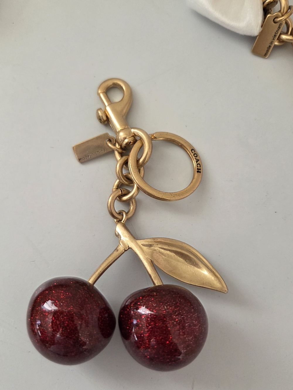COACH Red cherry keychain charm